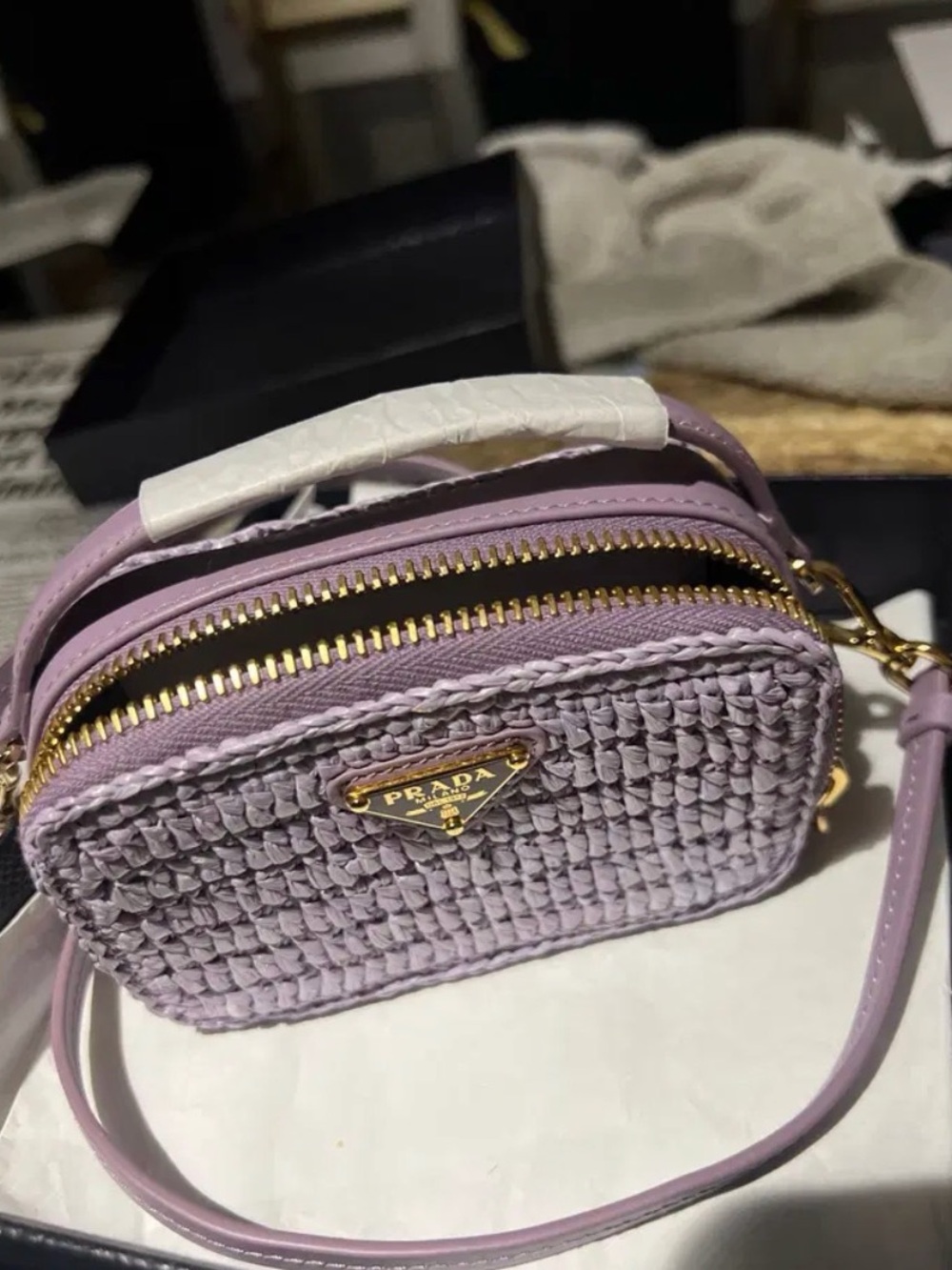 Authentic Prada mini pouch in purple crochet.